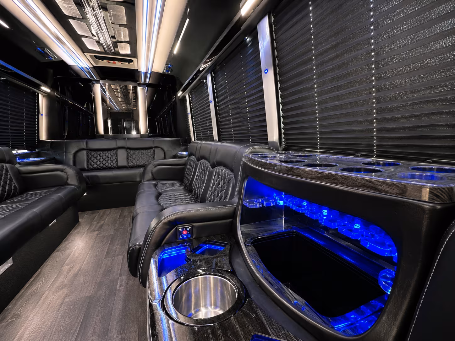 Friends laughing during a party bus celebration in Phoenix